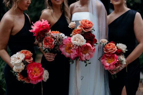 Wedding party blooms in warm and vibrant florals at Trawool Estate. Image: Kinship by Kristy